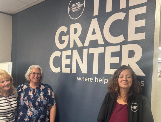 Volunteer Kathy Cooper, staff member Elizabeth Miller and Grace Center Director Monica Baroz in the clothes closet at the Grace Center. Justin Tubbs | MBT