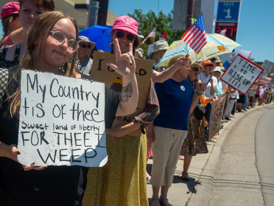Protesters line South Townsend Avenue on June 14 in Montrose. An estimated 2,500 people attended the rally to protest authoritarianism.  Peter Noebels Photography
