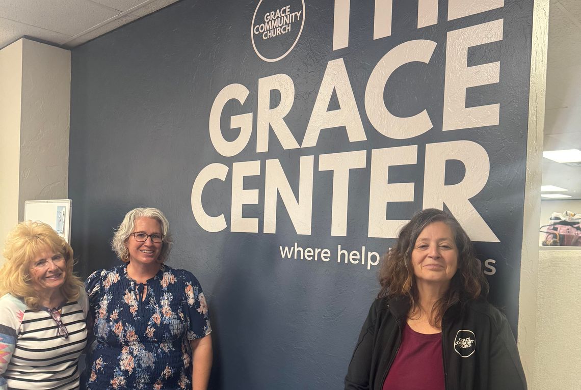 Volunteer Kathy Cooper, staff member Elizabeth Miller and Grace Center Director Monica Baroz in the clothes closet at the Grace Center. Justin Tubbs | MBT