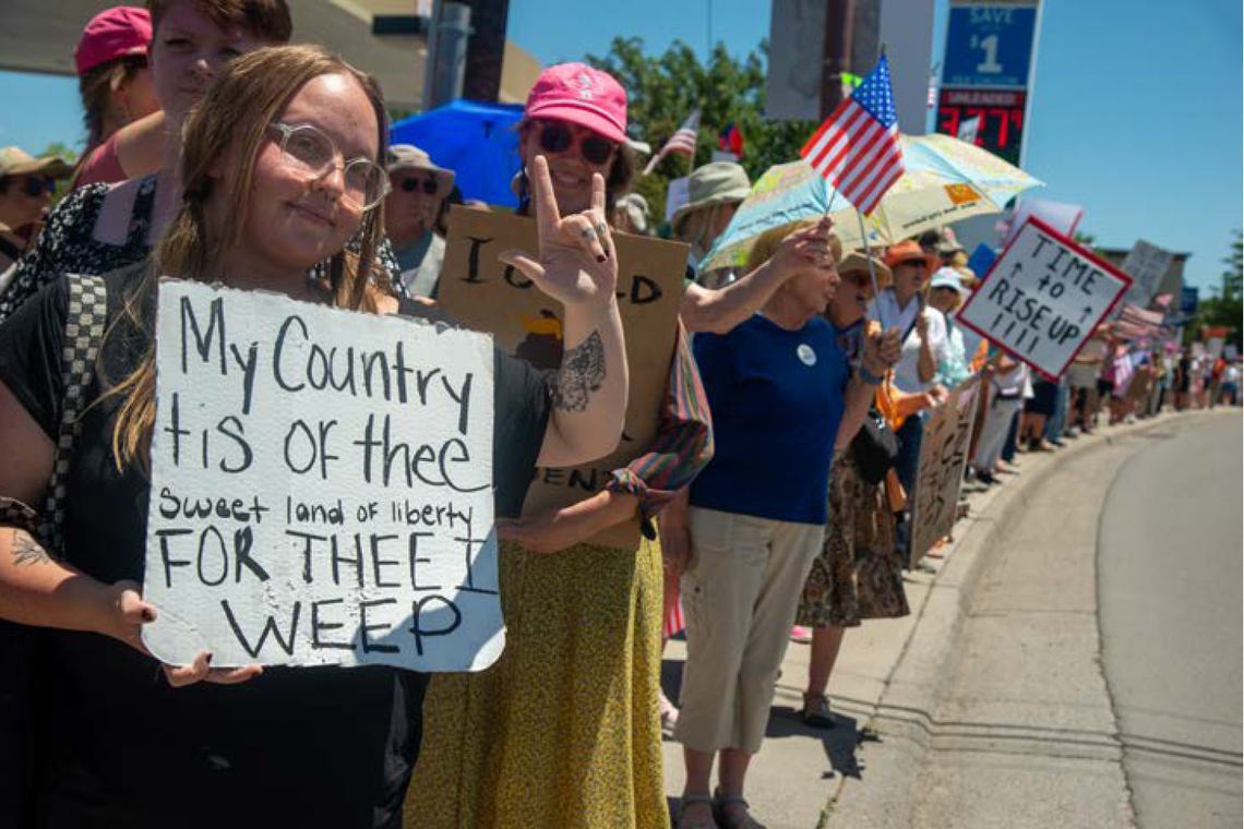 Protesters line South Townsend Avenue on June 14 in Montrose. An estimated 2,500 people attended the rally to protest authoritarianism.  Peter Noebels Photography